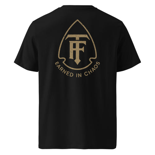 Back view of men's standard issue black tee true few with Earned in Chaos logo graphic